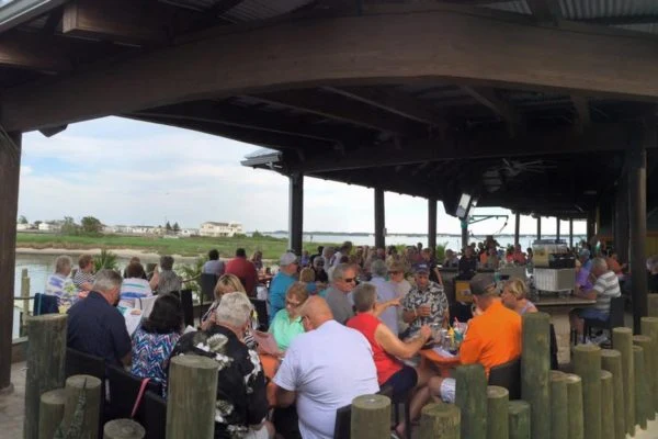 Guests dining along the lagoon